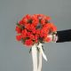 Букет невесты из рыжих роз и эрингиума