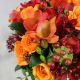 Свадебный красно-оранжевый букет из роз, фрезий, гиперикума Бабье лето